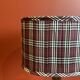 Lamp base in gilded brass, oval silk lampshade with a checkered pattern in burgundy.