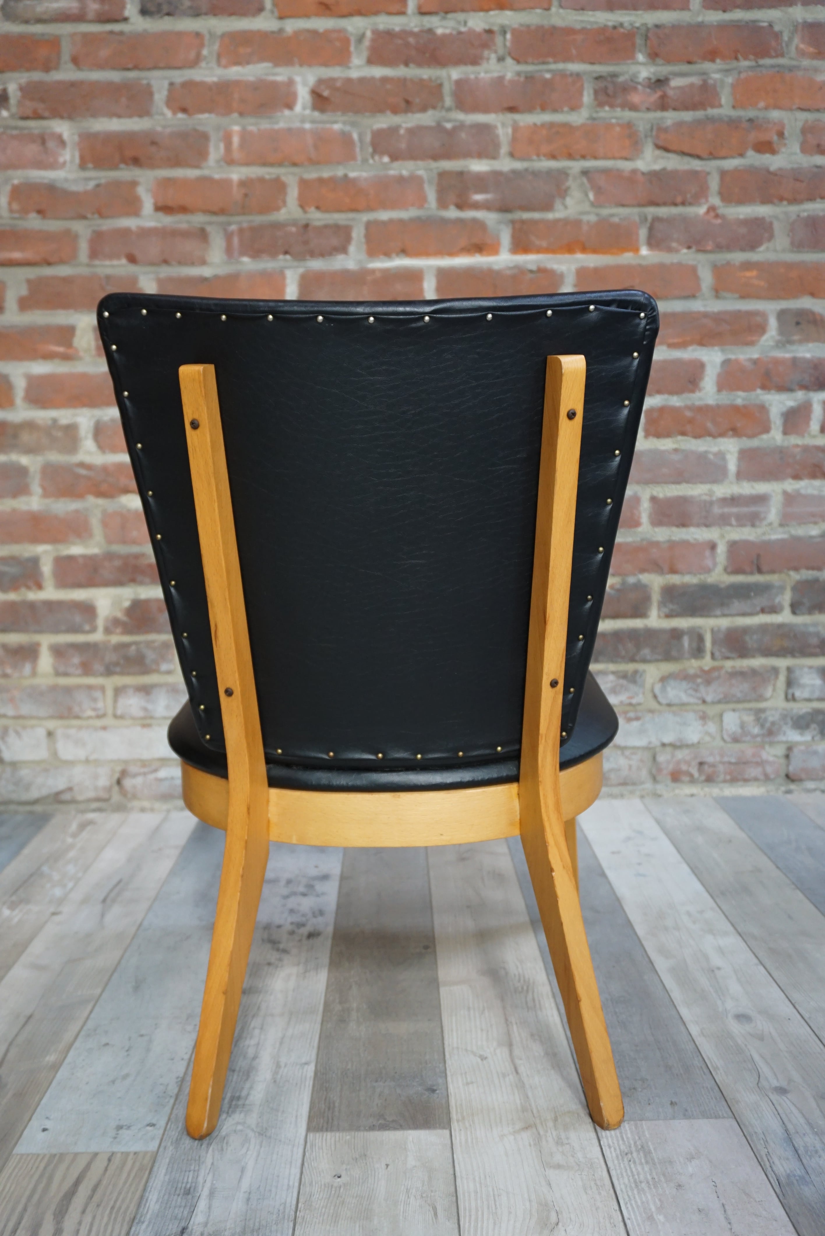 Chair 50 years in wood and faux black leather cocktail