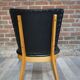 Chair 50 years in wood and faux black leather cocktail