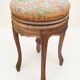 Swivel piano stool with screw, Louis XV style, in walnut.