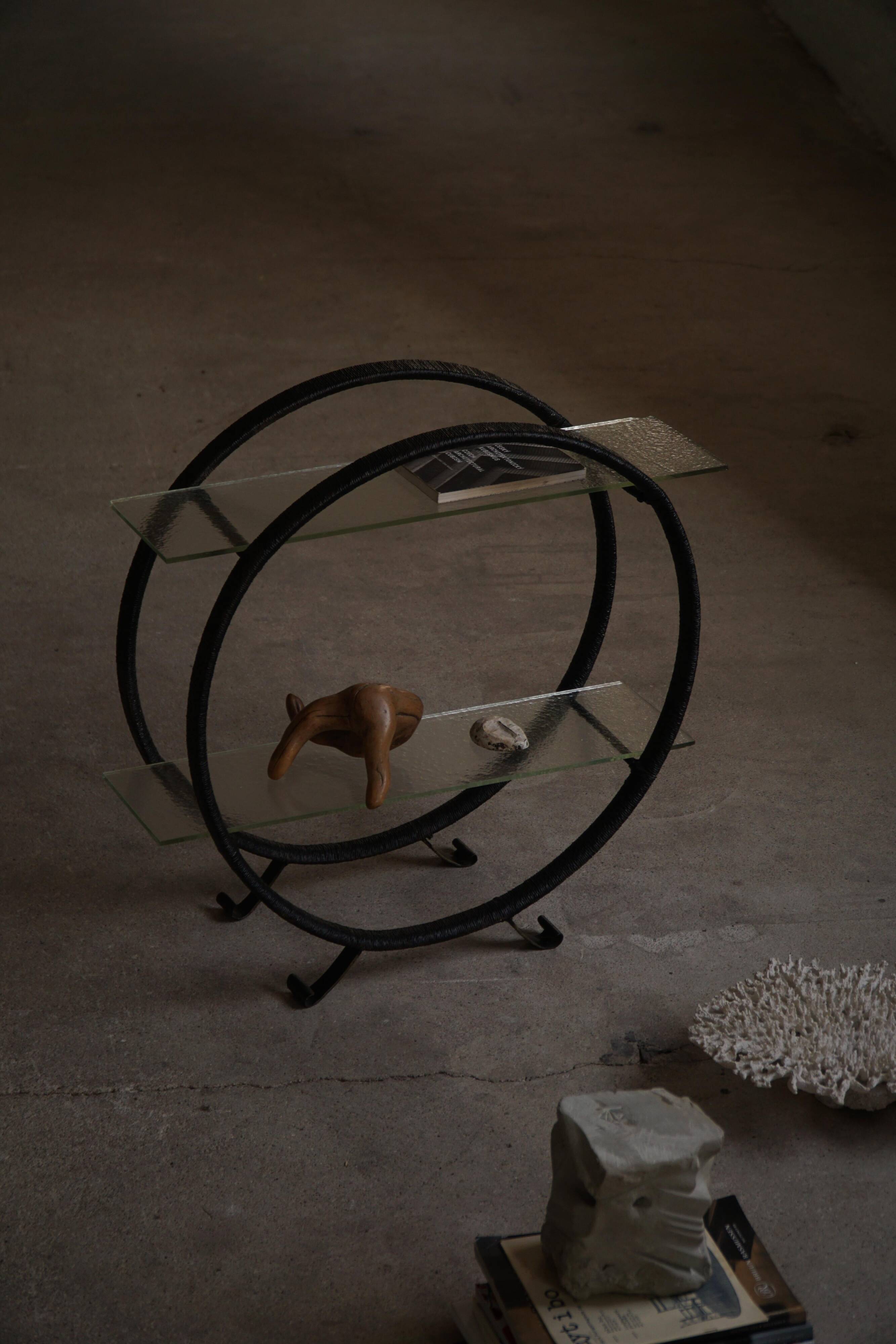 Decorative shelf unit, round metal frames with curved legs and glass shelves, 1960.