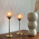 Pair of tulip-shaped candle holders in frosted glass and brass.