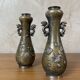 Pair of bronze vases - Asian motifs in relief in copper