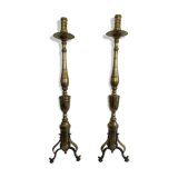 Pair of bronze and brass torch candlesticks