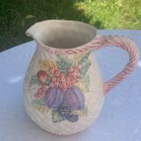 Glazed ceramic slip jug with vintage basket and fruit motif