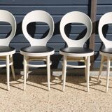 6 baumann chairs, white gull with black faux leather.