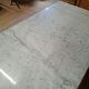 Pair of bistro tables in marble and cast iron.