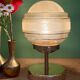 Vintage globe table lamp in frosted yellow and gold glass.