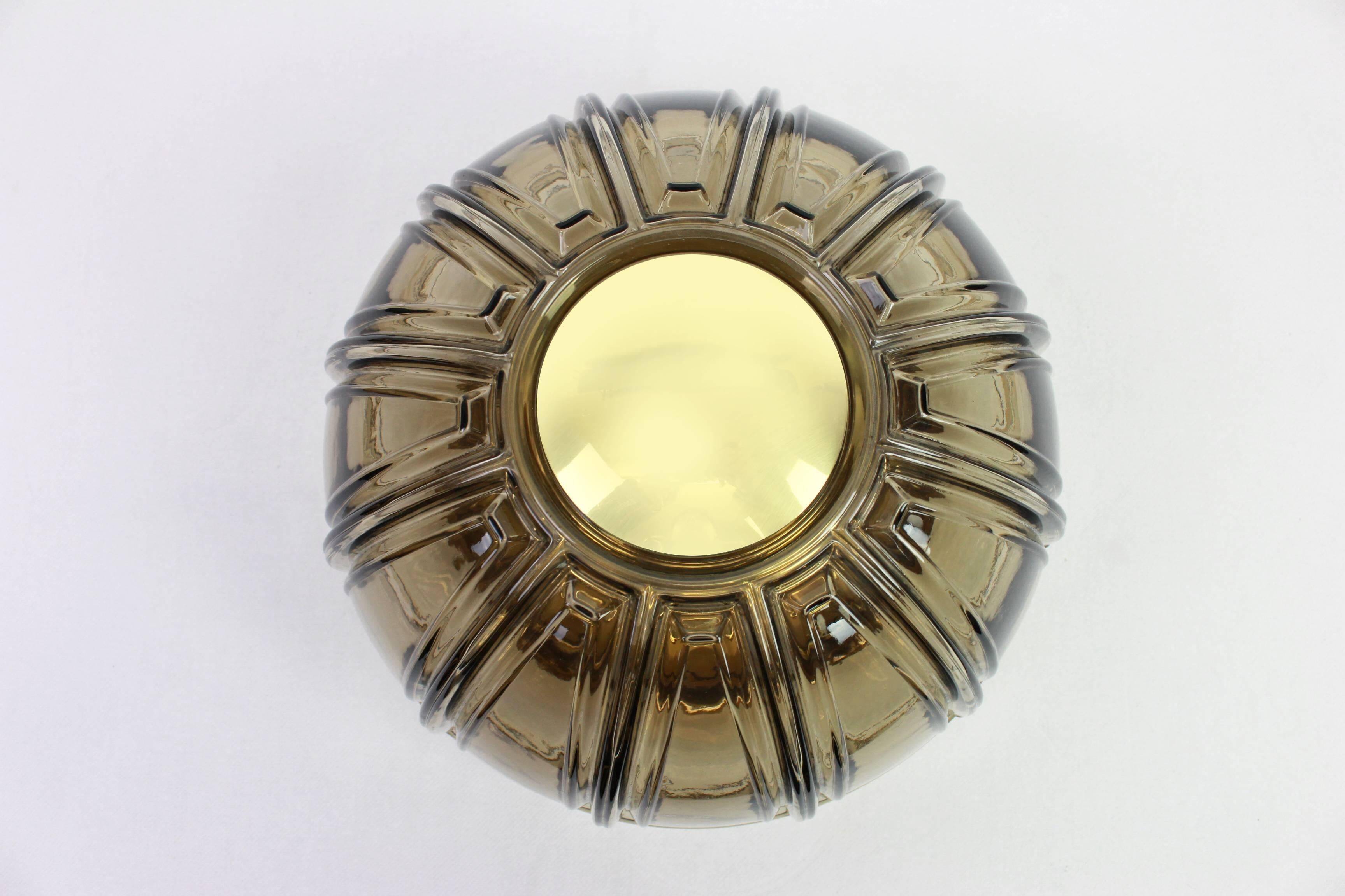 Pair of wall lights or ceiling lights in brass and amber glass by Limburg, Germany, 1960s.