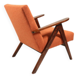 Vintage orange curly armchair Scandinavian design 1970