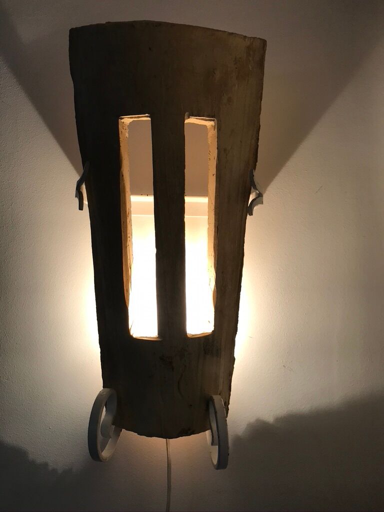 Lot of three terracotta and wrought iron appliques