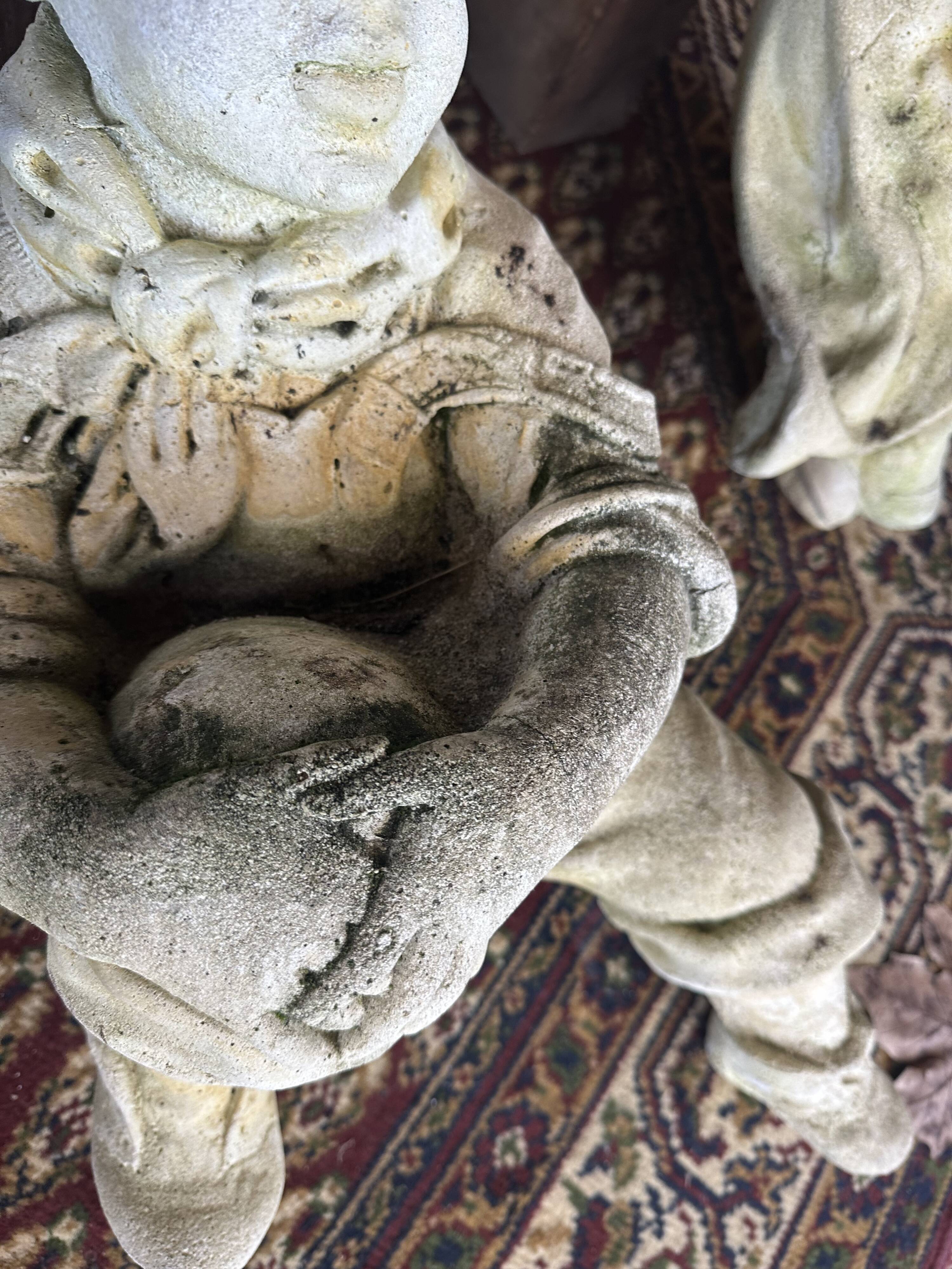 Stone child garden statue