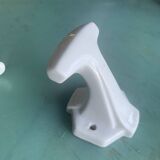 Two white porcelain coat hooks, one small and one larger, old