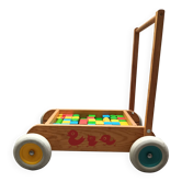 Walking trolley with multicolored wooden cubes