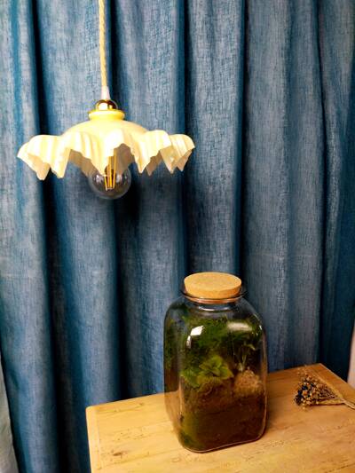 Suspension with draped yellow glass lampshade