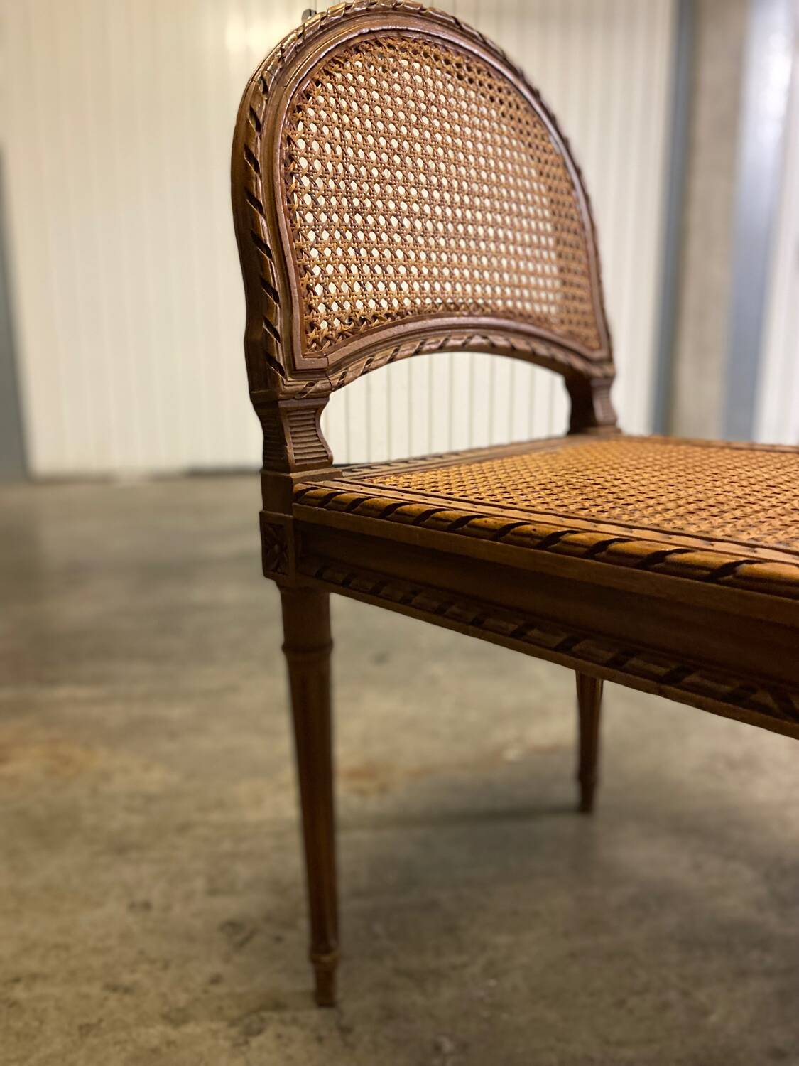 Wooden and cane bench (piano bench)