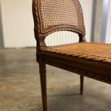 Wooden and cane bench (piano bench)