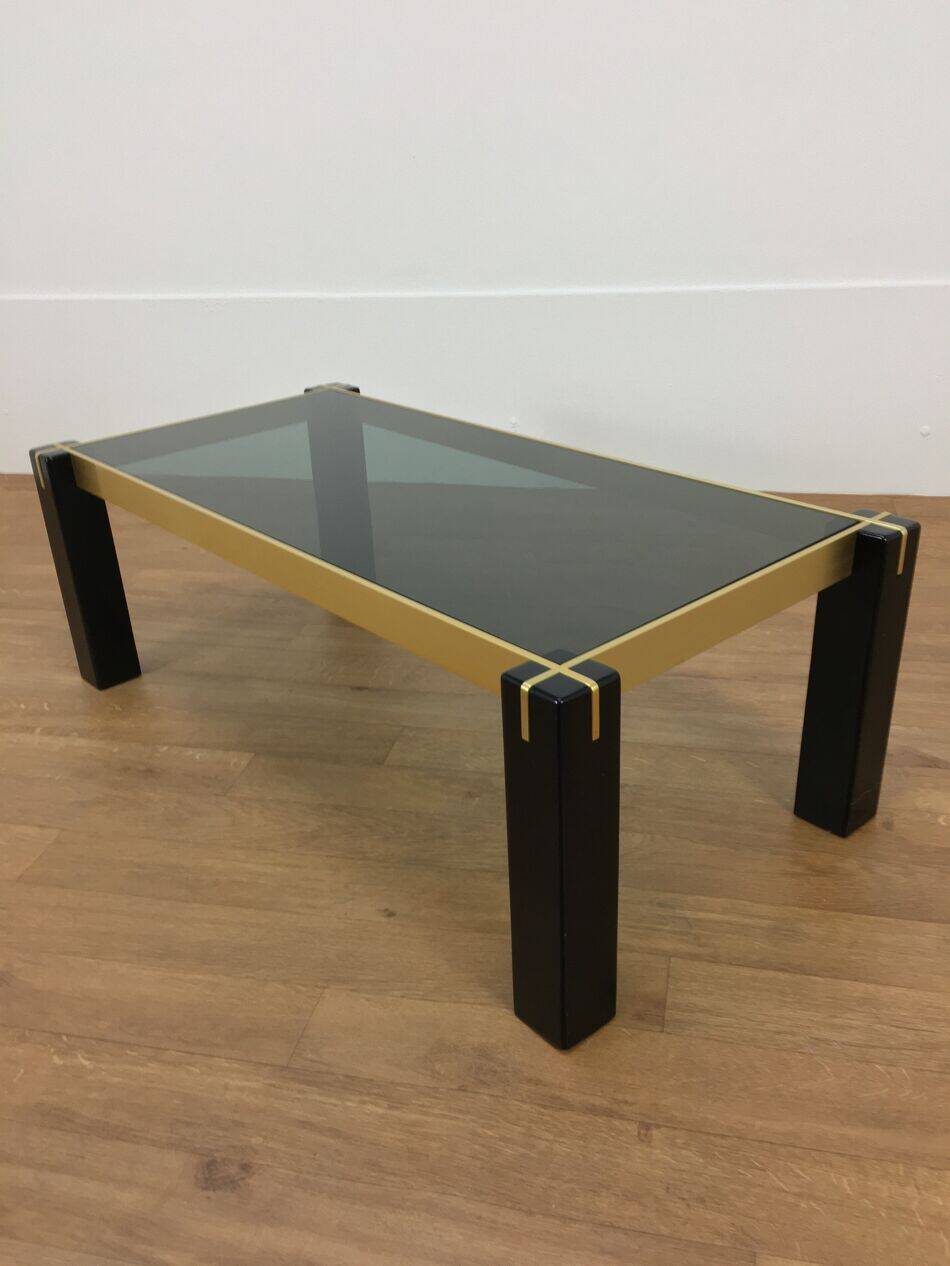 Italian coffee table from the 70s, smoked glass, black and gold lacquered wood.