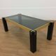 Italian coffee table from the 70s, smoked glass, black and gold lacquered wood.