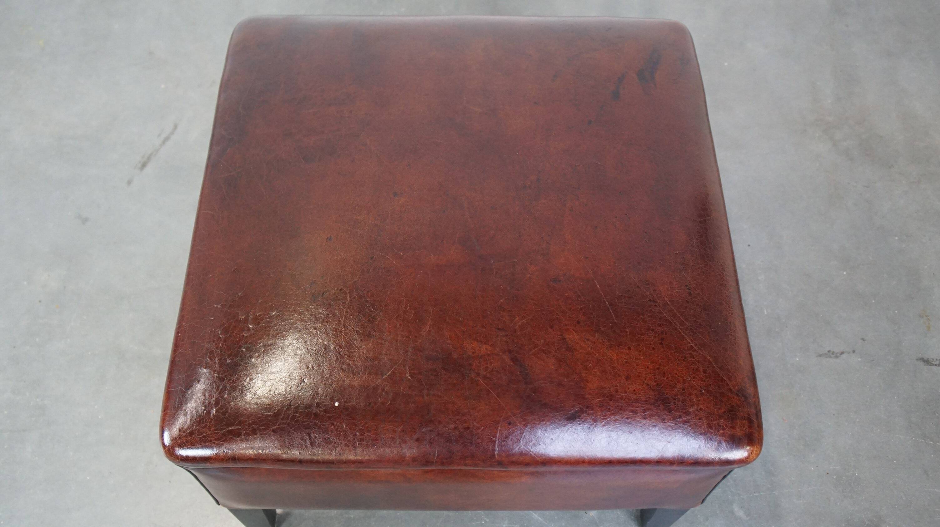 Large square sheepskin leather ottoman with a beautiful patina