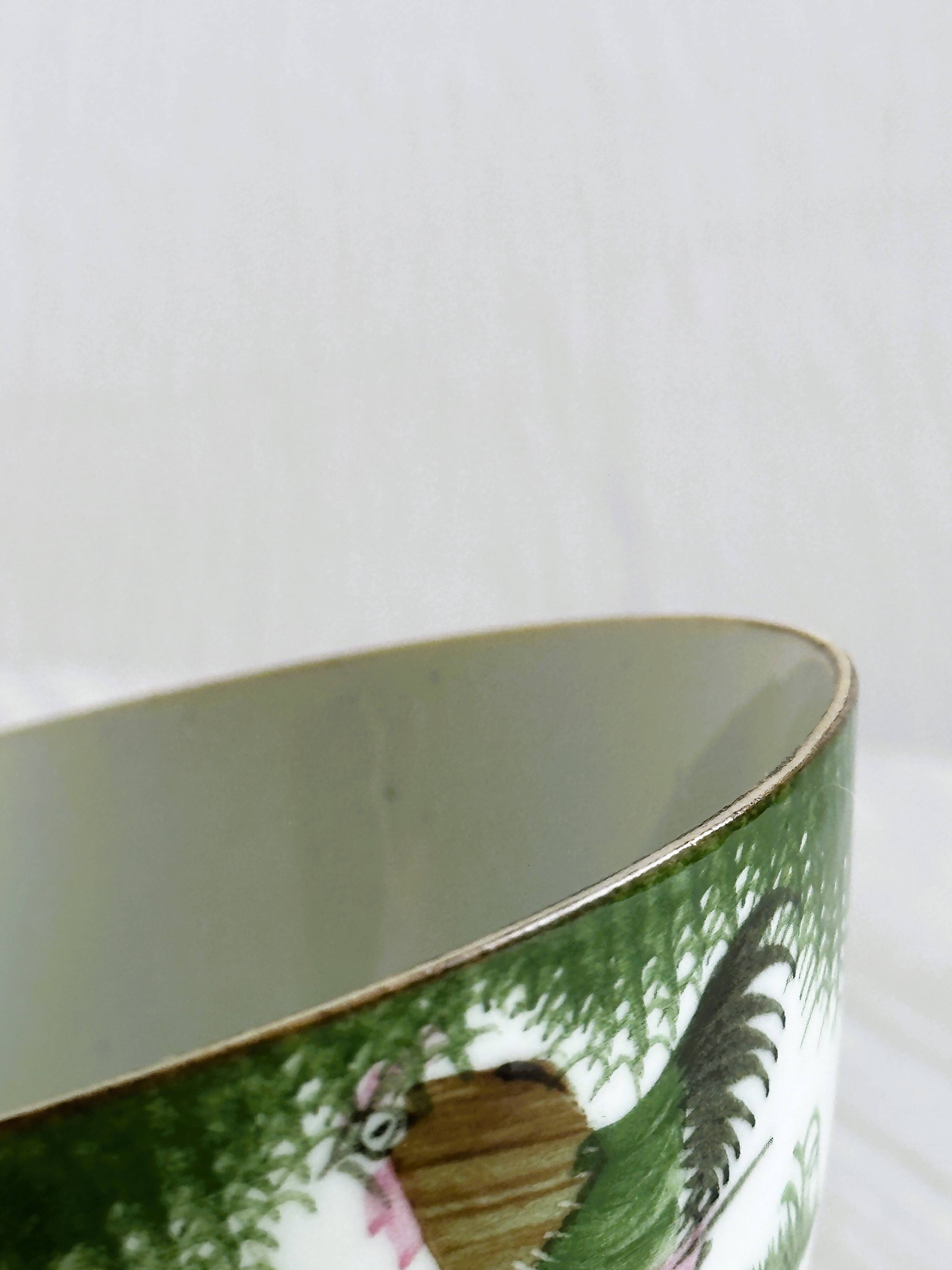 Antique porcelain bowl with rooster motif