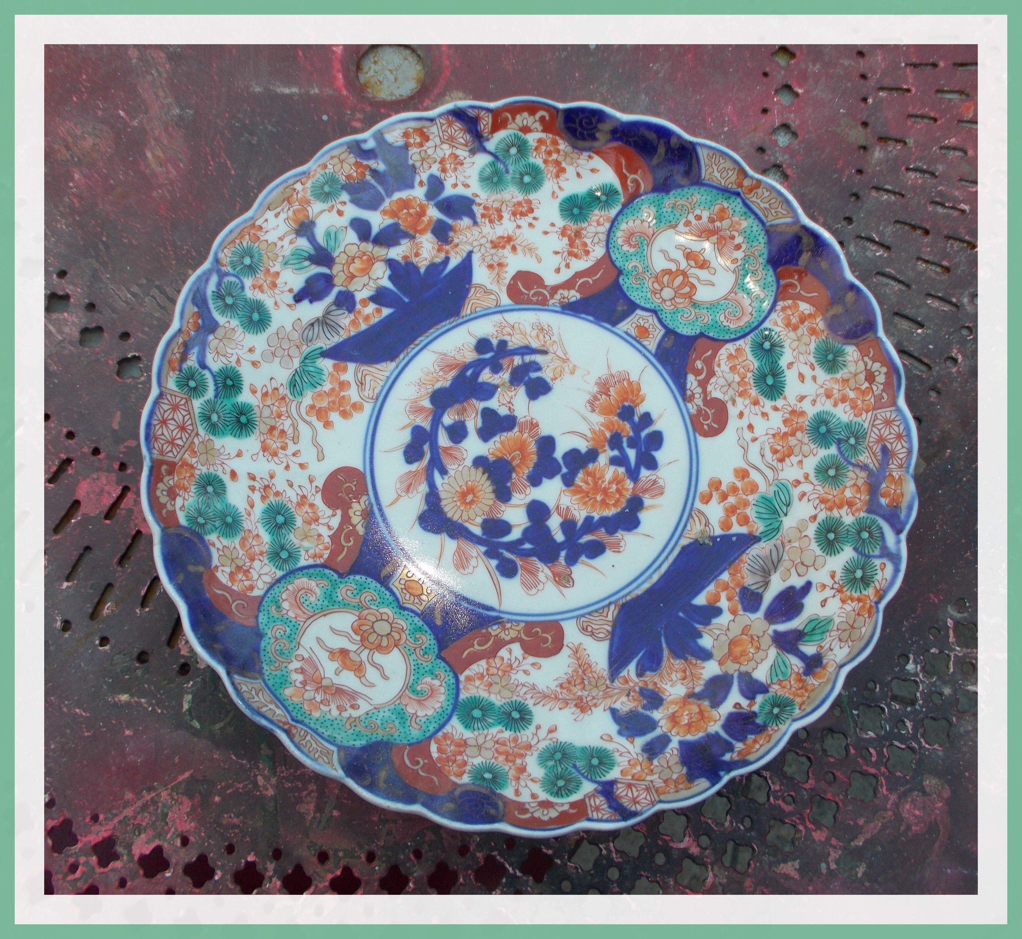 Ancient round porcelain dish from Japan Imari