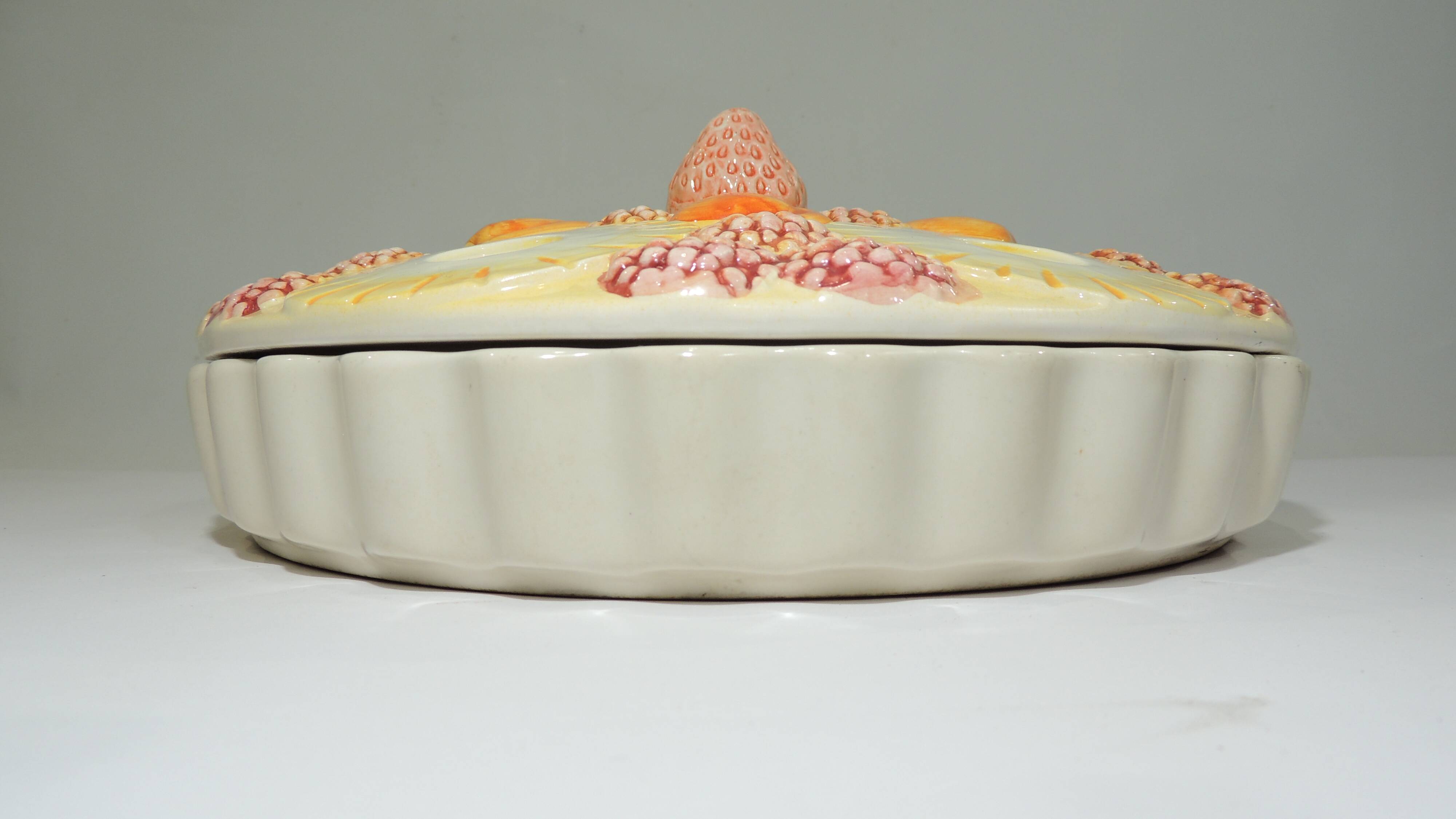 Magnificent fruit tart dish in slip signed "What's Vincent Cadeaux