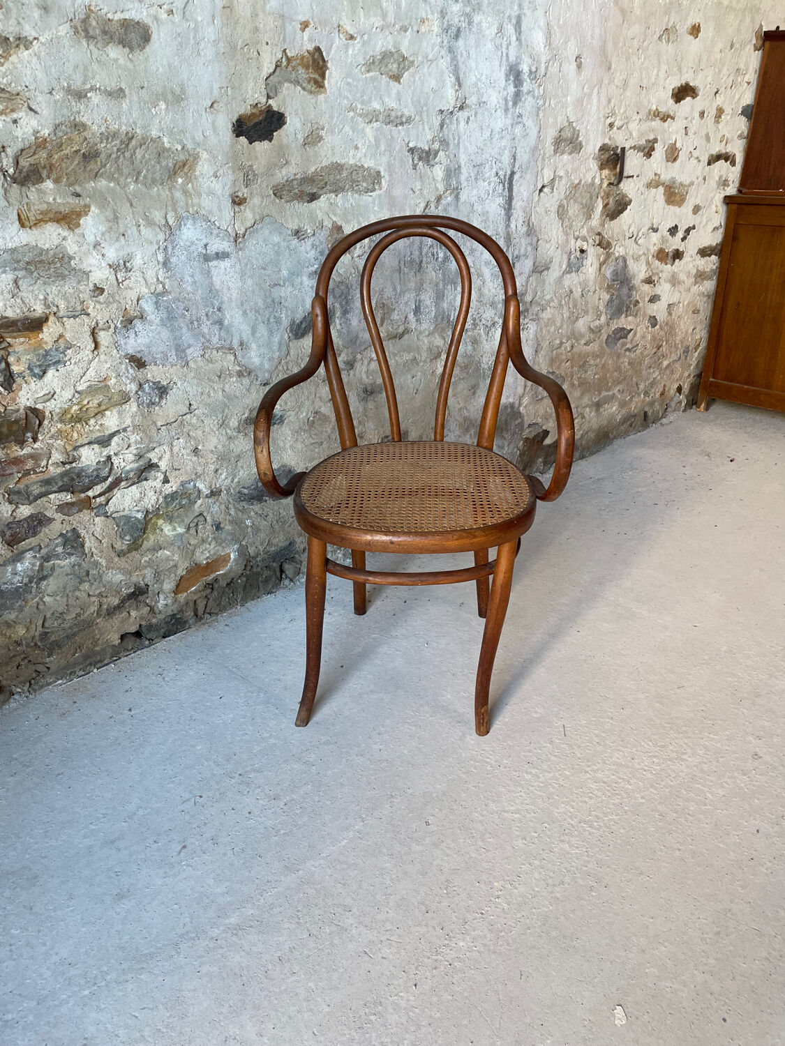 Thonet armchair with bent wood and caning