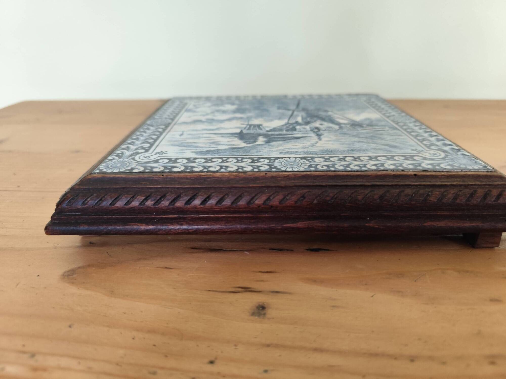 Ceramic tile trivet and wooden frame with Dutch windmill.