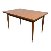 Vintage extendable dining table with tapered legs.