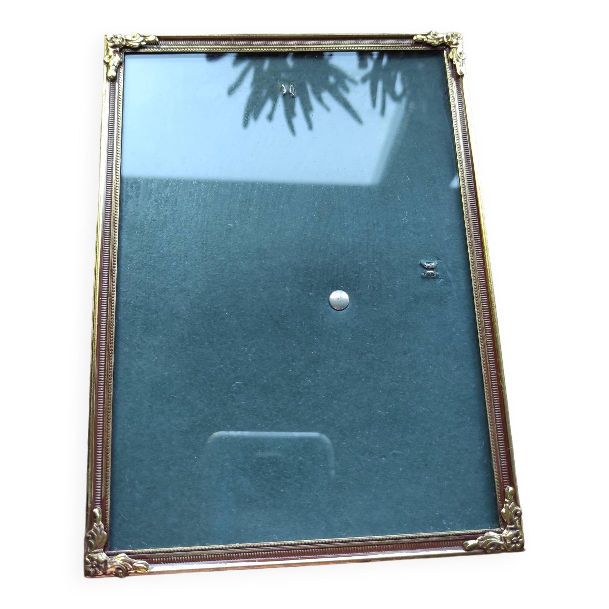Vintage photo frame in gold and decorated metal
