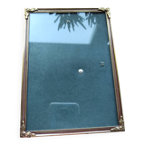 Vintage photo frame in gold and decorated metal