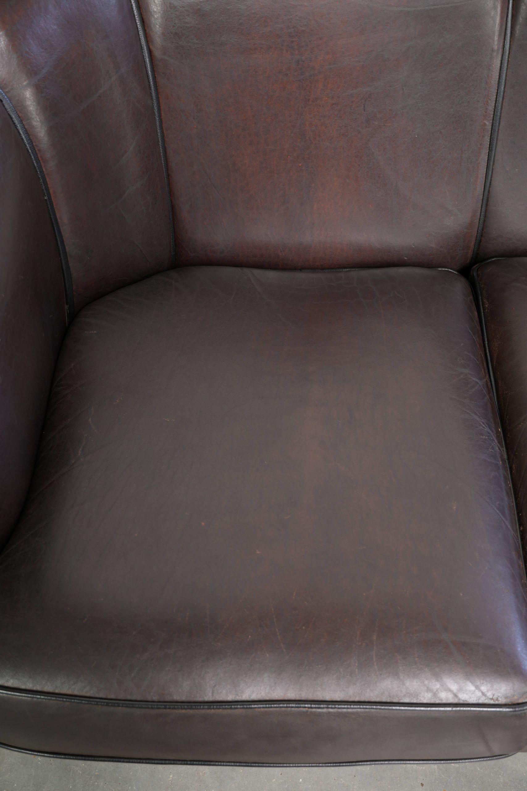 Unique sheepskin 3-seater sofa with deep colours and a distinctive design