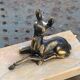 Table lamp, Biche, fawn in gilded brass on a beige marble base, art deco Velvet underside