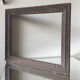 Antique wooden frame with geometric carvings light distress