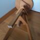 Tripod stool with a screw.