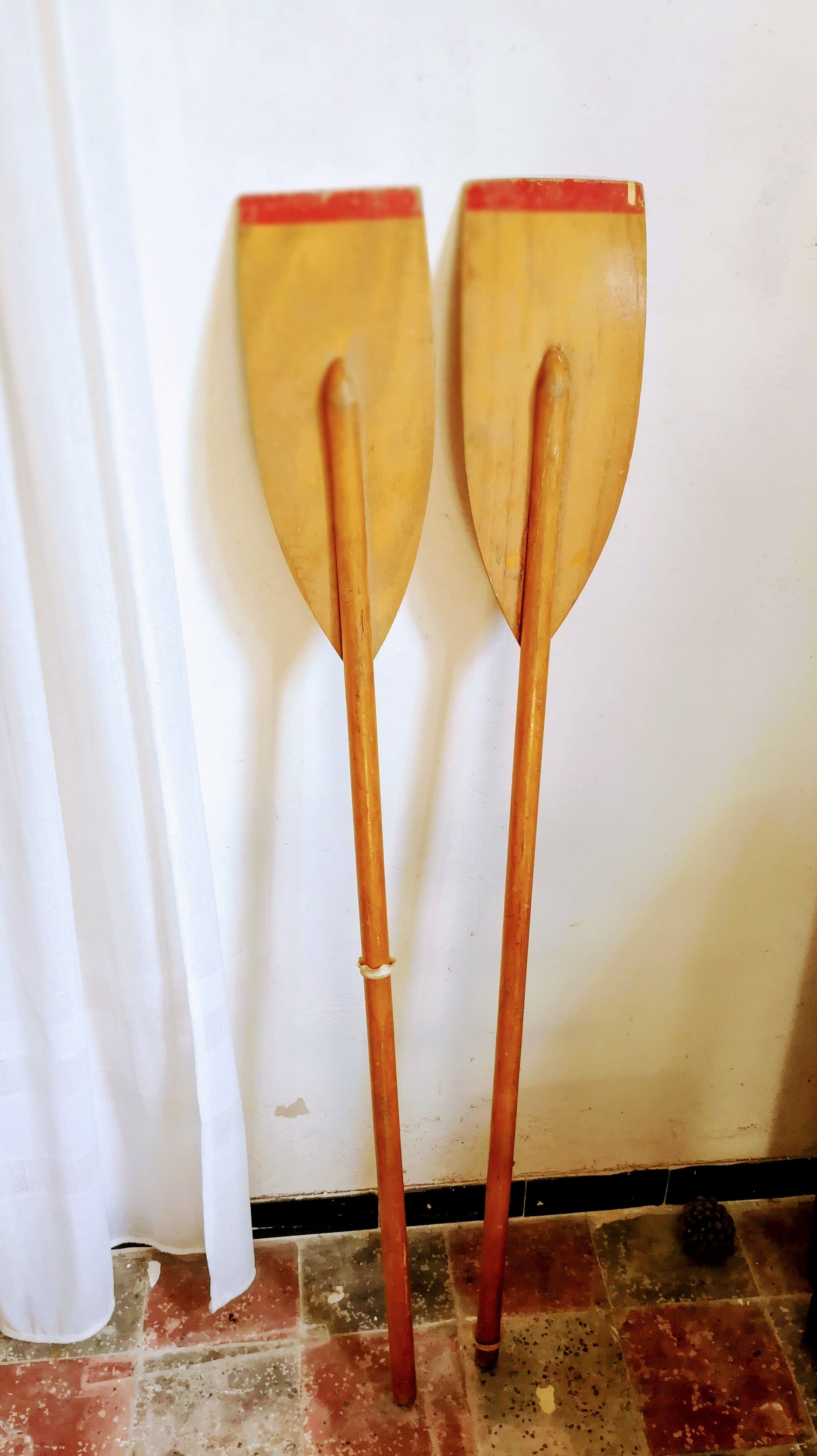 Pair of old wooden oars