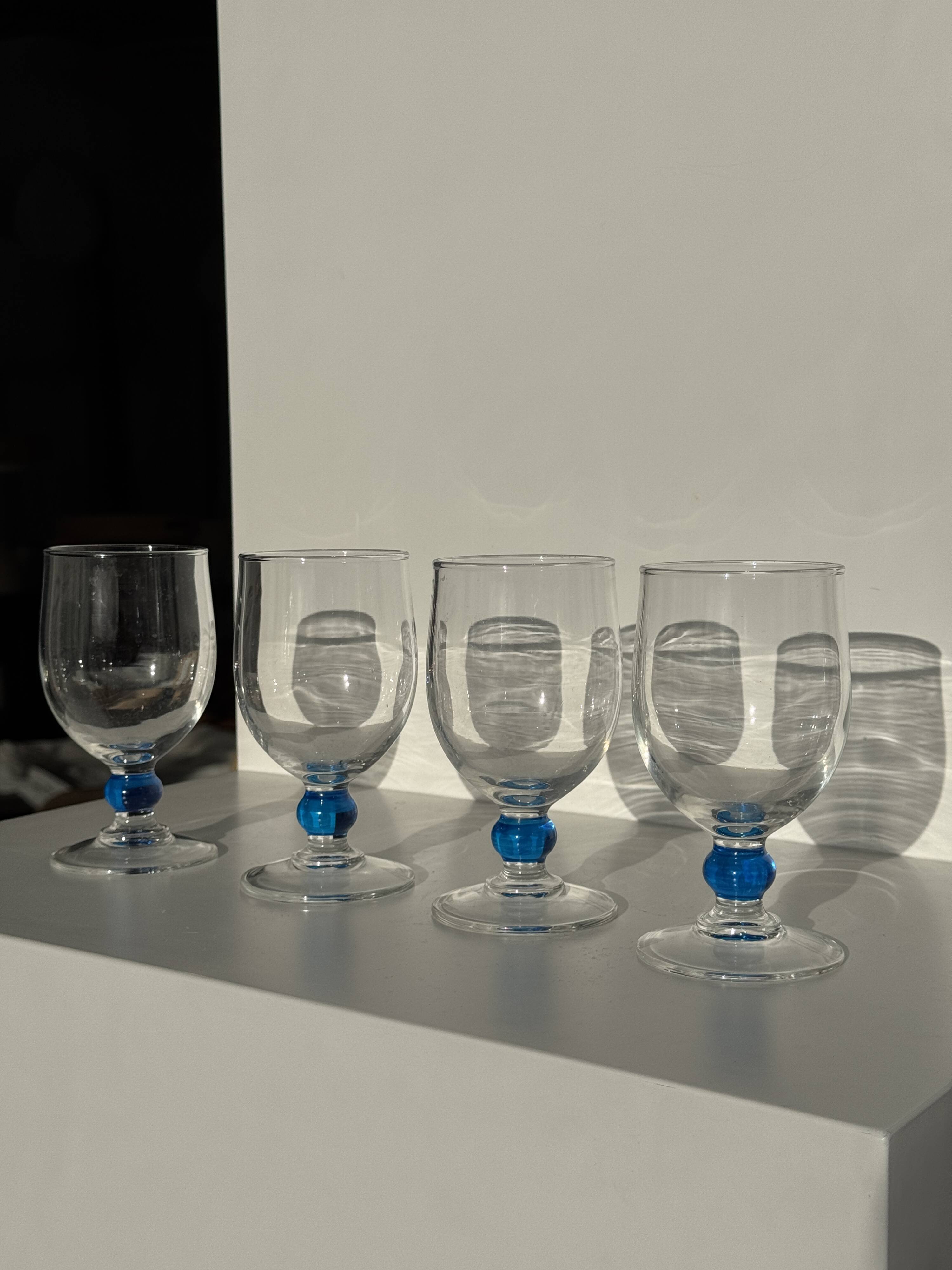 Set of 4 blue ball stemmed water glasses