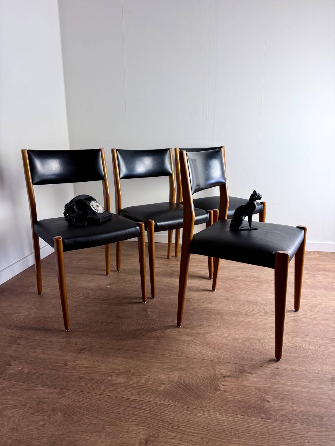 Set of 4 wooden and black leatherette chairs