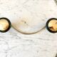 silver and black metal coat hook from the 70s