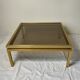Glass and brass coffee table