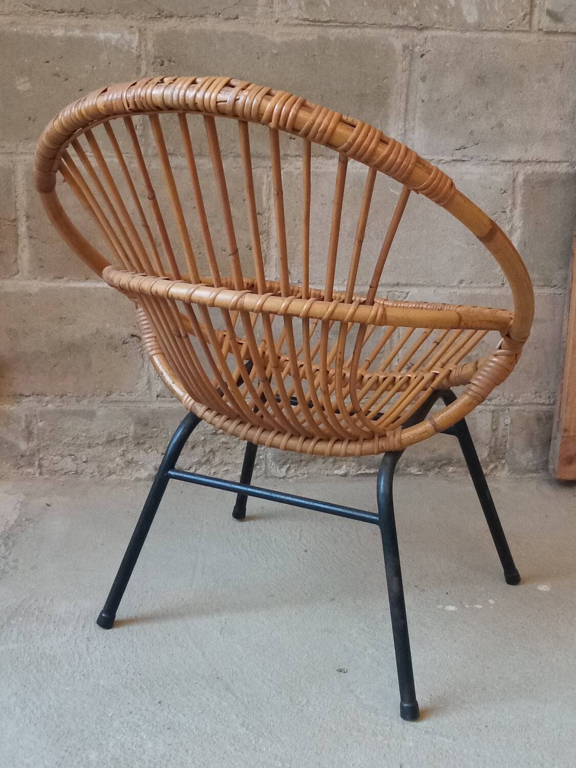 Rattan armchair with metal base from the 1950s