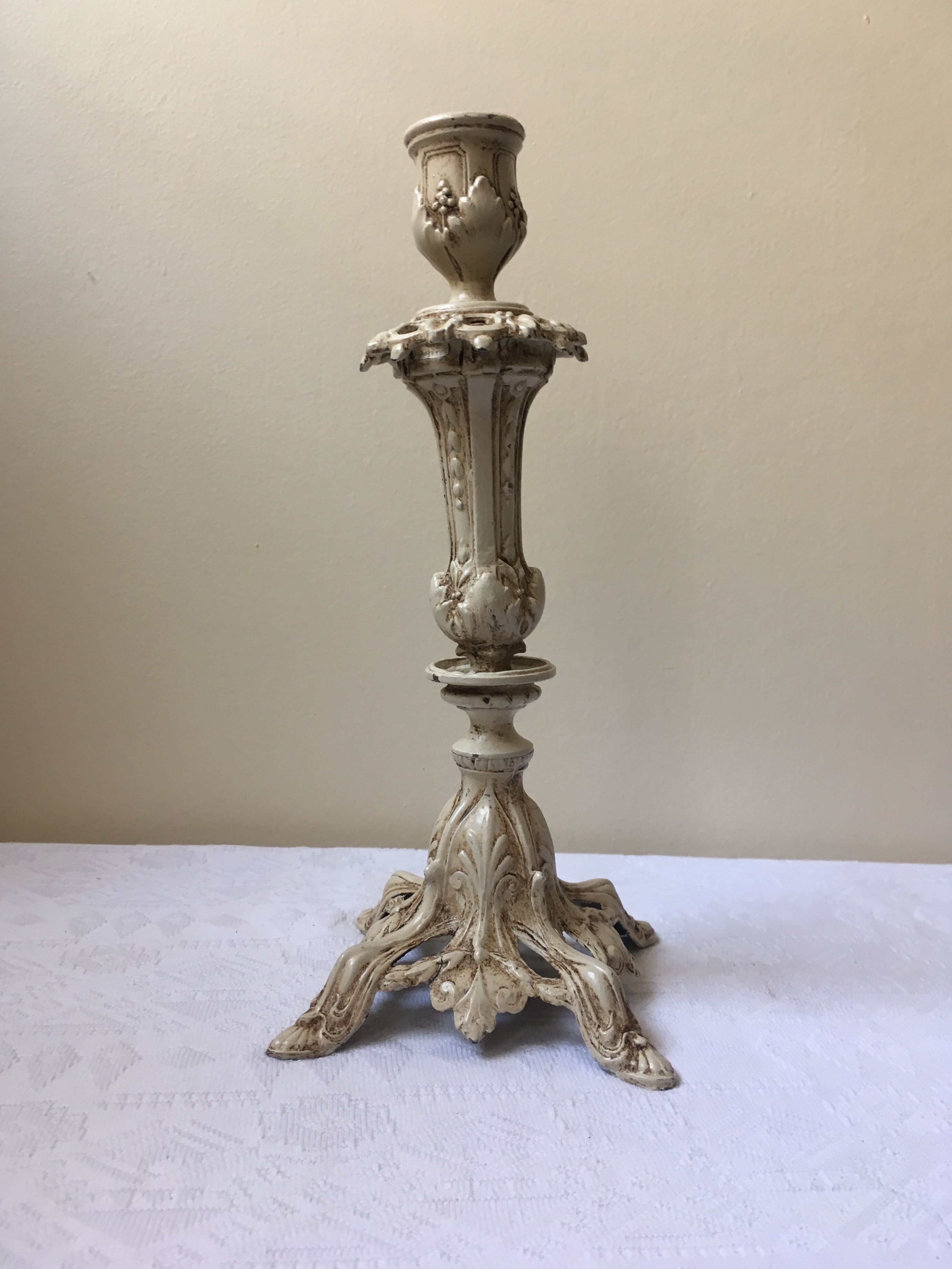 Large candle holder in patinated white painted metal