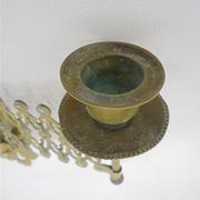 Wall-moving candlestick