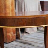 Table basse art déco de forme ronde en palissandre de rio.
