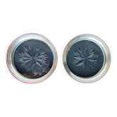 2 Bottle coasters in cut glass and silver metal