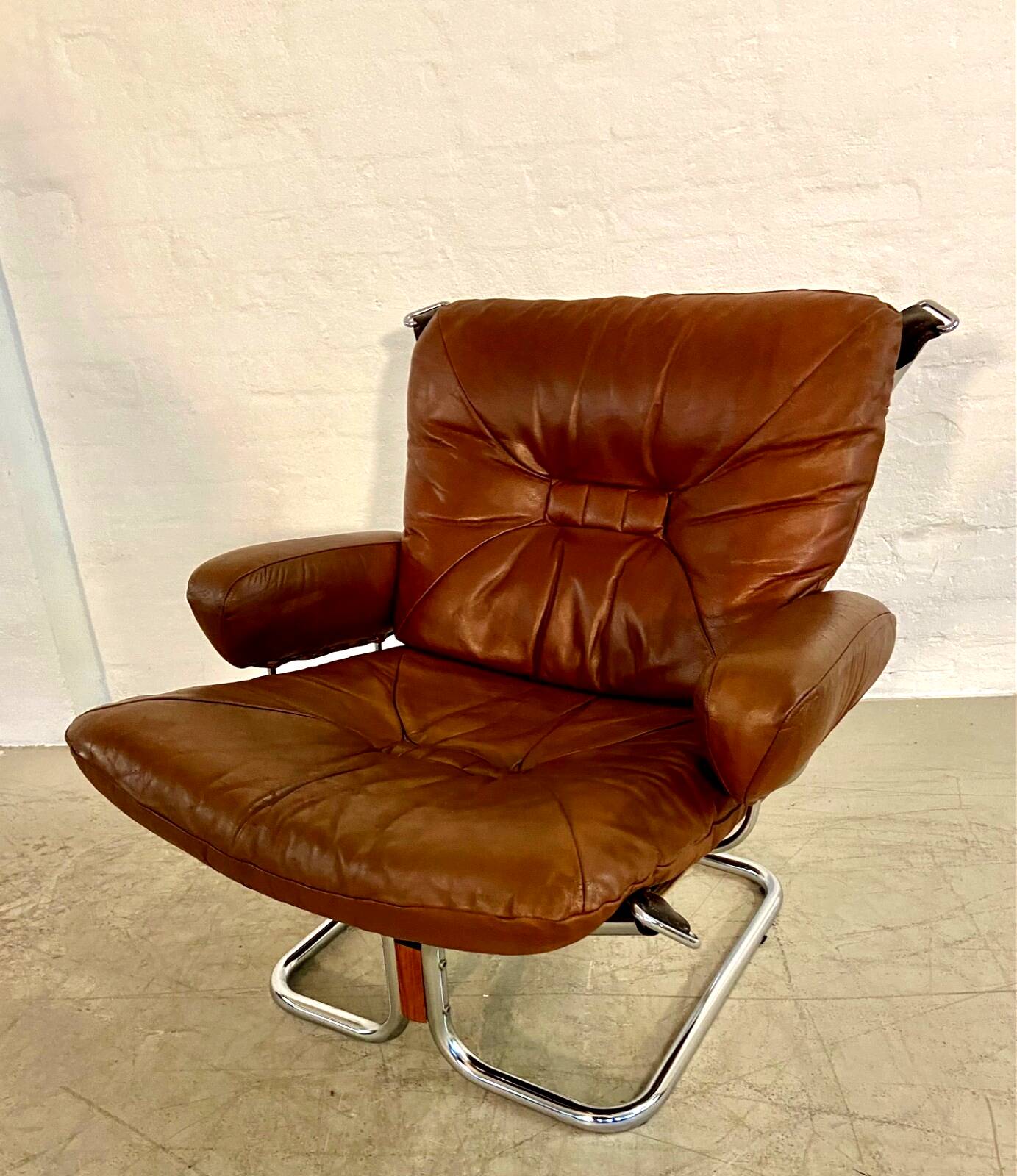Vintage mid-century Scandinavian cognac leather lounge chair by Harald Relling