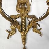 Pair of antique bronze wall lights. Louis style candlestick lamps.