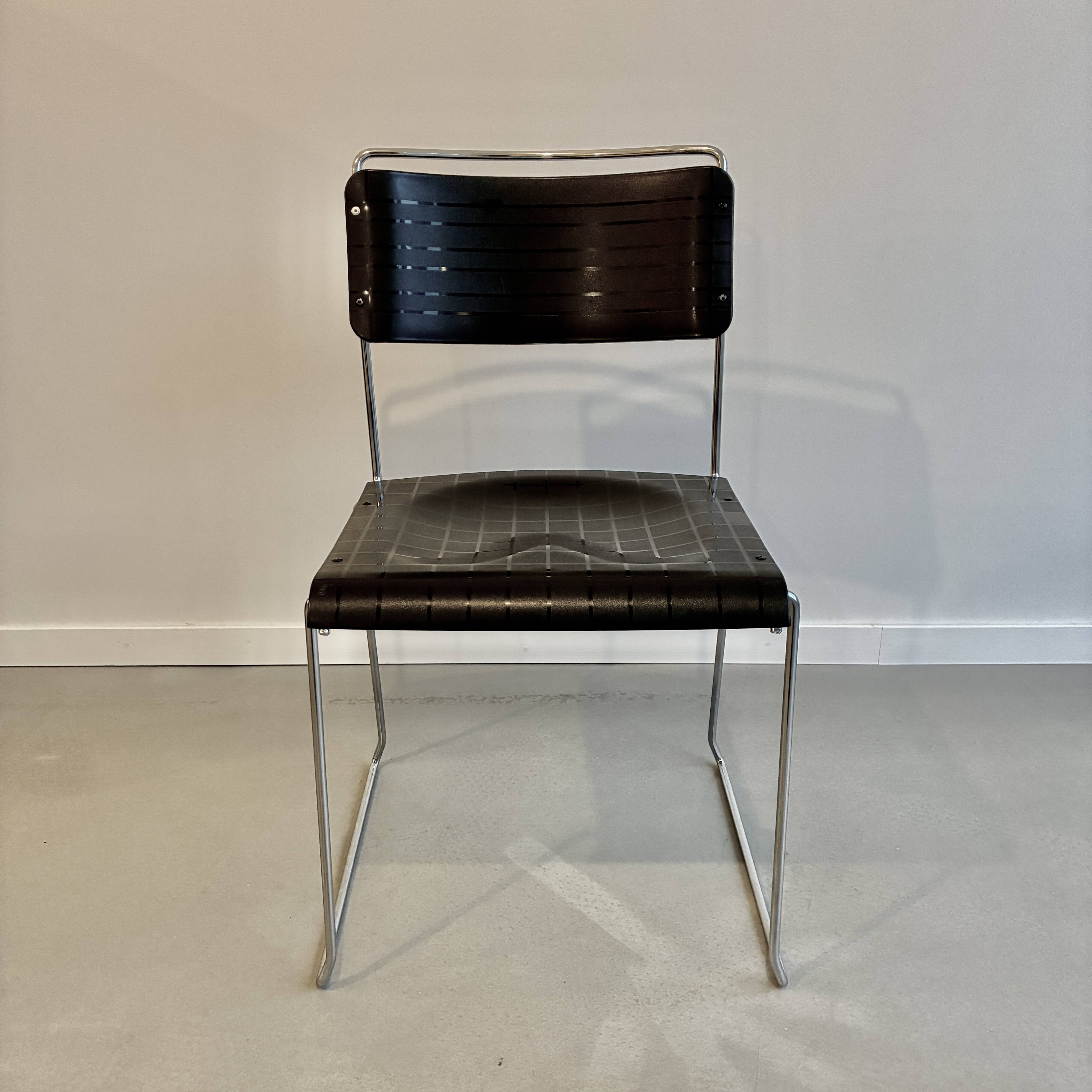 4 Spilimbergo chairs from Italy in chrome steel and black plastic.