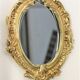 Pair of louis XV beveled mirror wall lamps in bronze by "Lucien Gau"